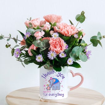 Nurturing Comforts (6 Pink Carnations with Disney Mug)