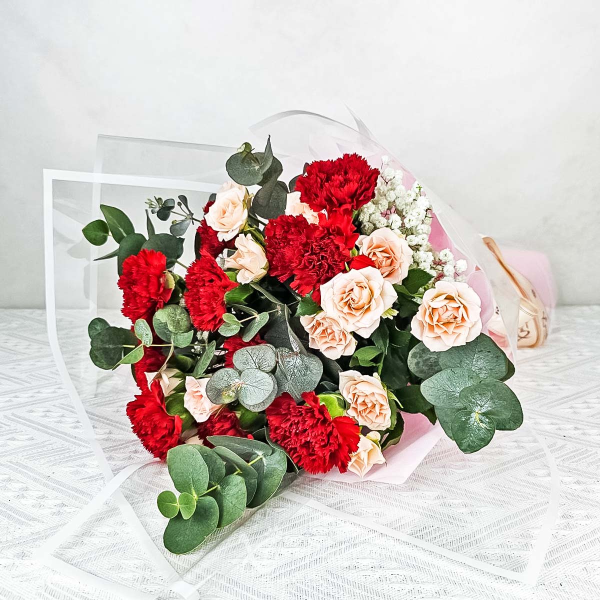 MDBQ2409 Crimson Charm (12 Red Carnations with Pink Rose Sprays) 1c
