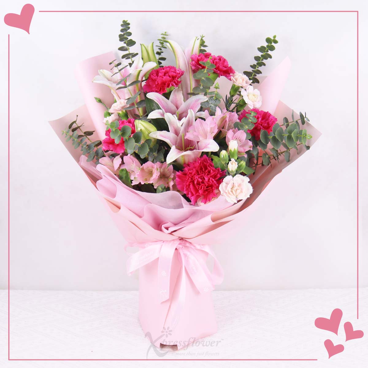 Blush Tribute (Pink Lily Sprays with 5 Pink Carnations)