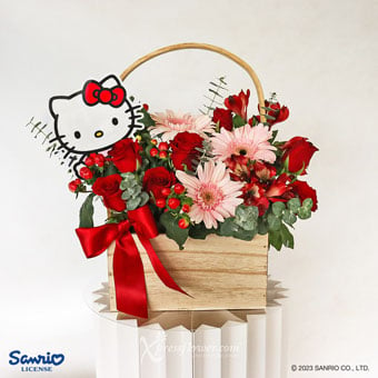 Radiant Perfection (Hello Kitty Tag with 7 Red Roses & 3 Pink Gerbera Arrangement in Basket)