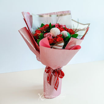 Nurturing Bold (6 Yam Roses, 6 Red Carnations & 3 Pink Ping Pong Chrysanthemum)