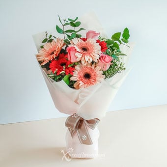 Blushing Affections (3 Dark Pink Roses with 6 Mix Pink & Red Gerberas)
