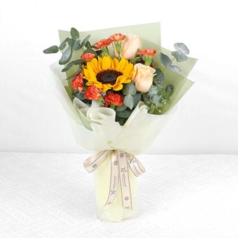 Enchanting Meadows (Sunflower & Champagne Roses with Orange Carnation Sprays)
