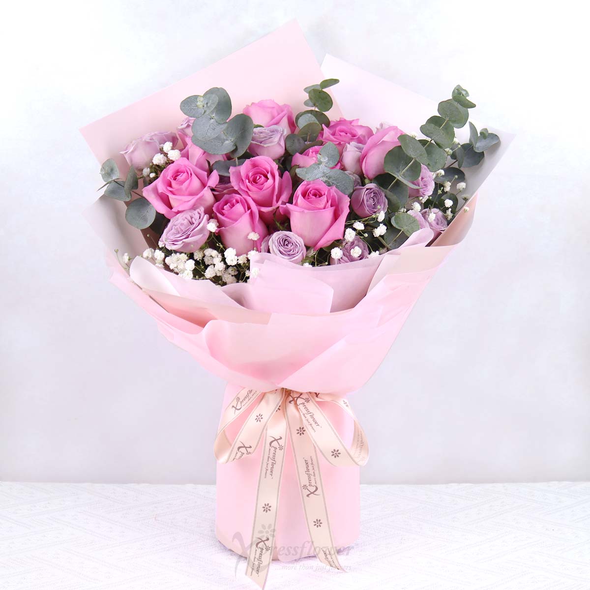 Passionate Blush (12 Dark Pink Roses with Lilac Rose Spray)