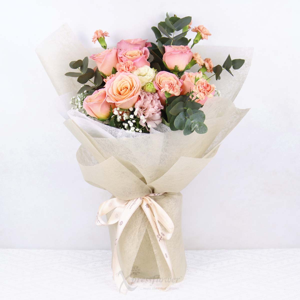 Peachy Grace (9 Piggy Roses with Orange Carnation Sprays)