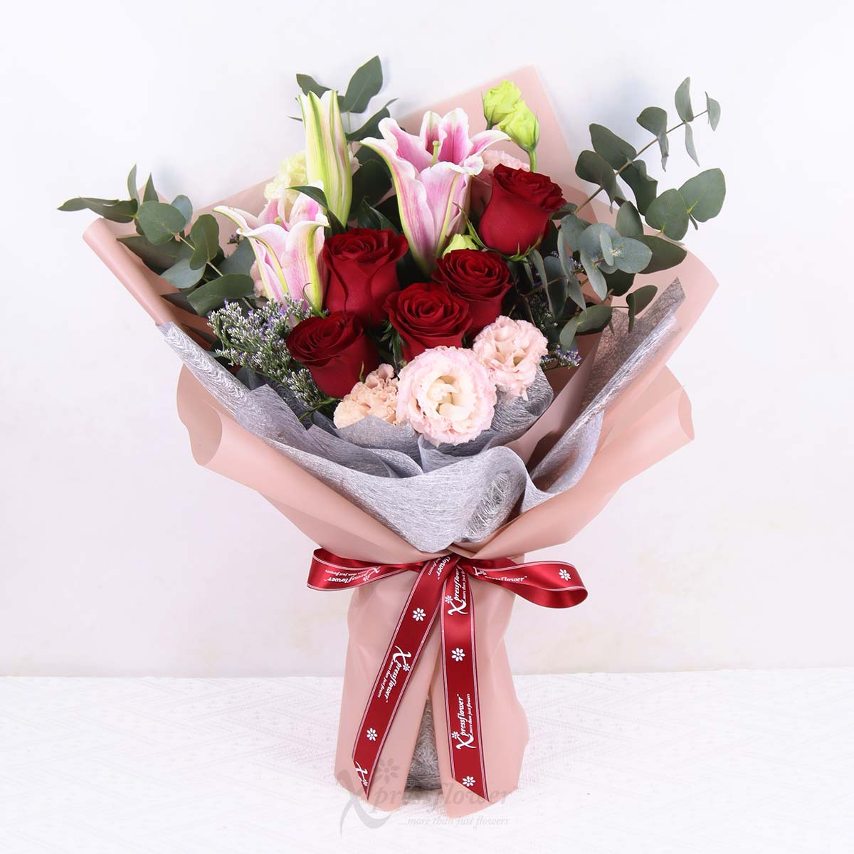 Radiant Grace (Pink Lily Spray with 5 Red Roses)